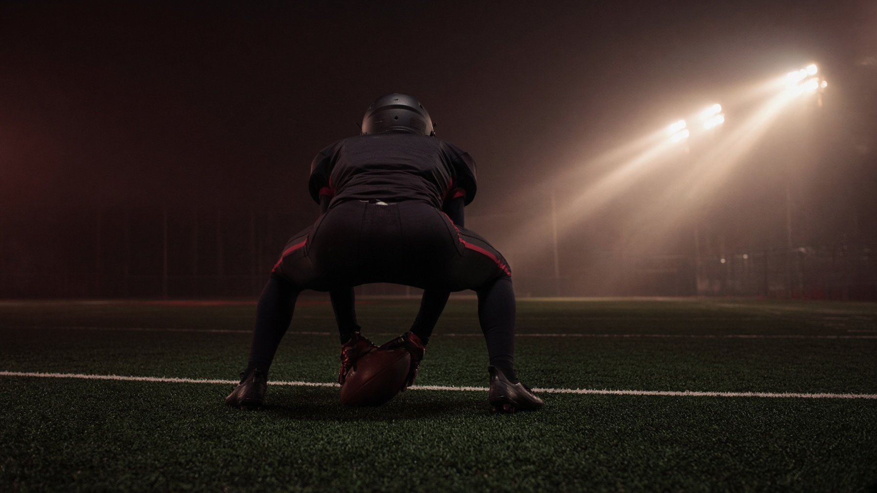 Long snapper under stadium lights in Chelsea, Alabama